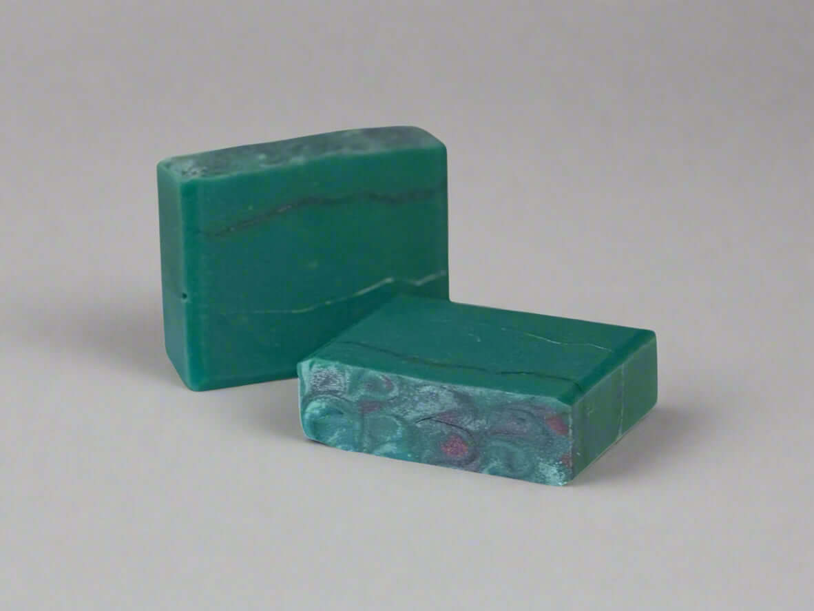 Prick'n Awesome handmade soap bars in vibrant teal with elegant pin lines, perfect for nourishing skin care.