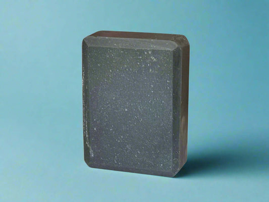 Handmade Fellas soap for men with a wet leather fragrance, featuring natural hues from the curing process.